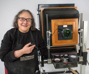 Photographer Elsa Dorfman with her 20x24 Polaroid camera in her studio. (Jesse Costa/WBUR)